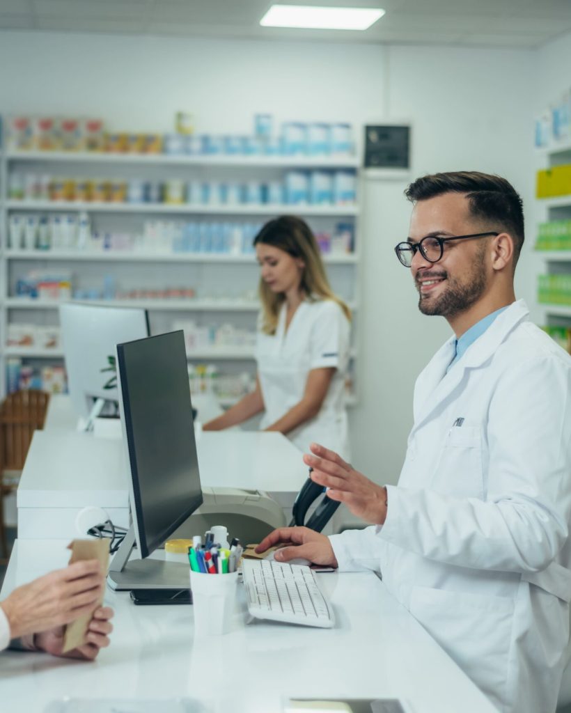 male-pharmacist-selling-medications-at-drugstore-t-2025-04-01-13-05-40-utc