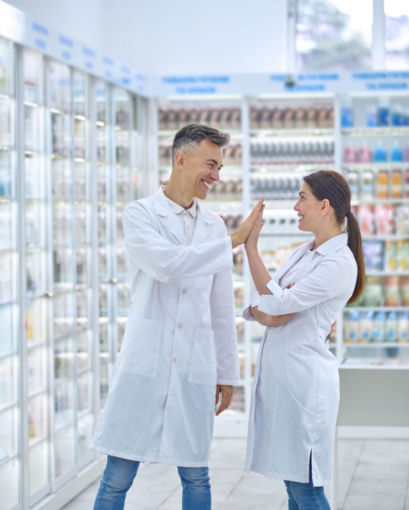 two-people-in-lab-coats-feeling-good-and-smiling-2024-10-18-07-30-58-utc